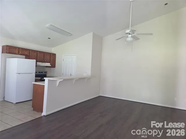 a view of a kitchen with electric appliances