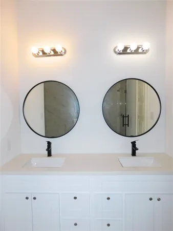 a bathroom with a sink and mirror