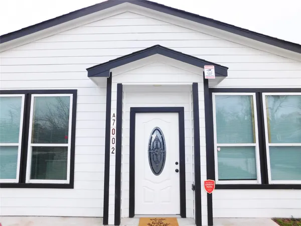 a front view of a house with a porch