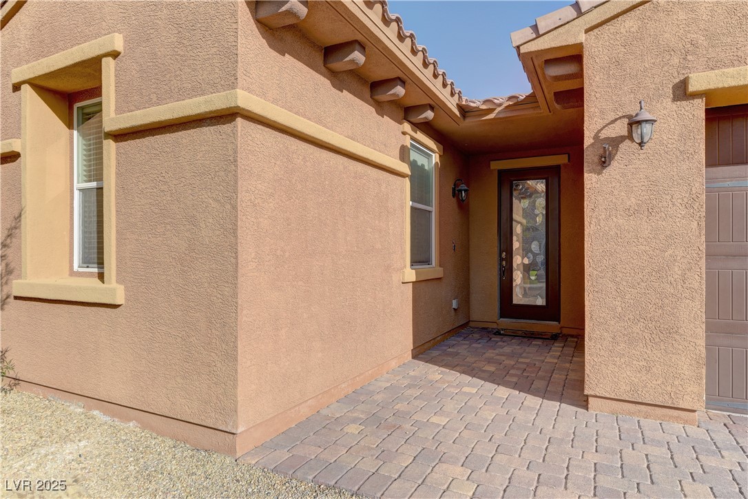 972 Rue Grand Paradis Lane Henderson, NV 89011 - Photo 3 of 32 View of exterior entry with stucco siding