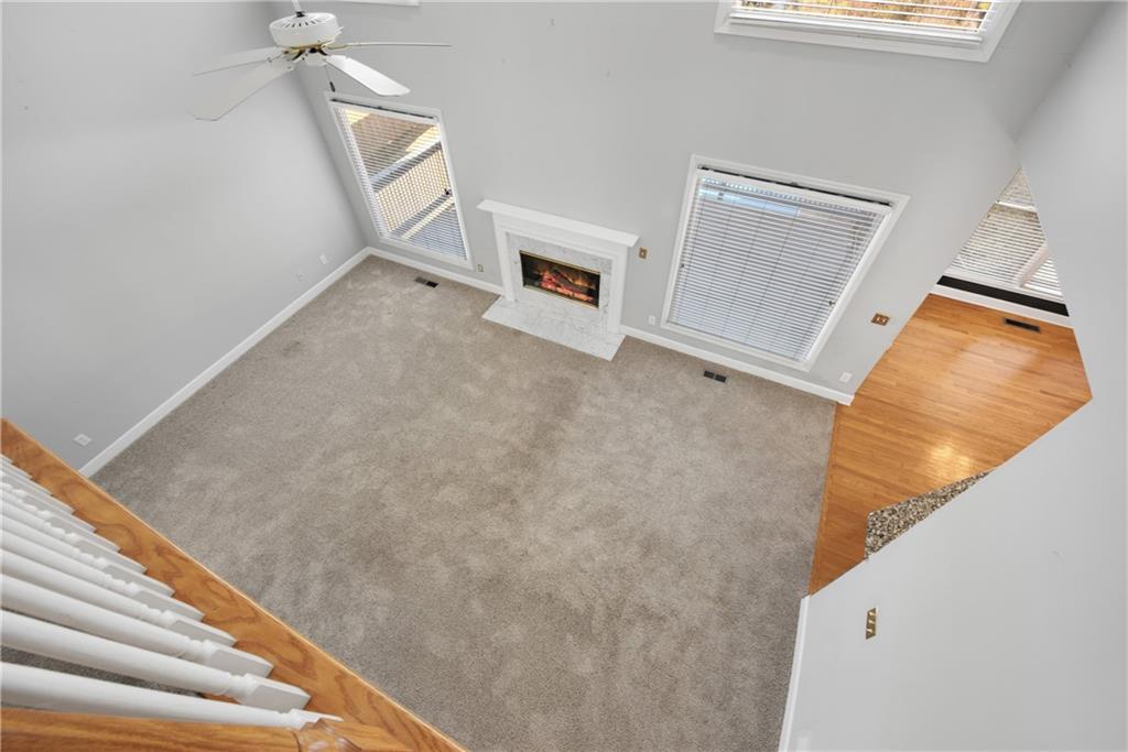 161 Brook Lane Roswell, GA 30075 - Photo 24 of 66 a view of a livingroom with wooden floor and staircase