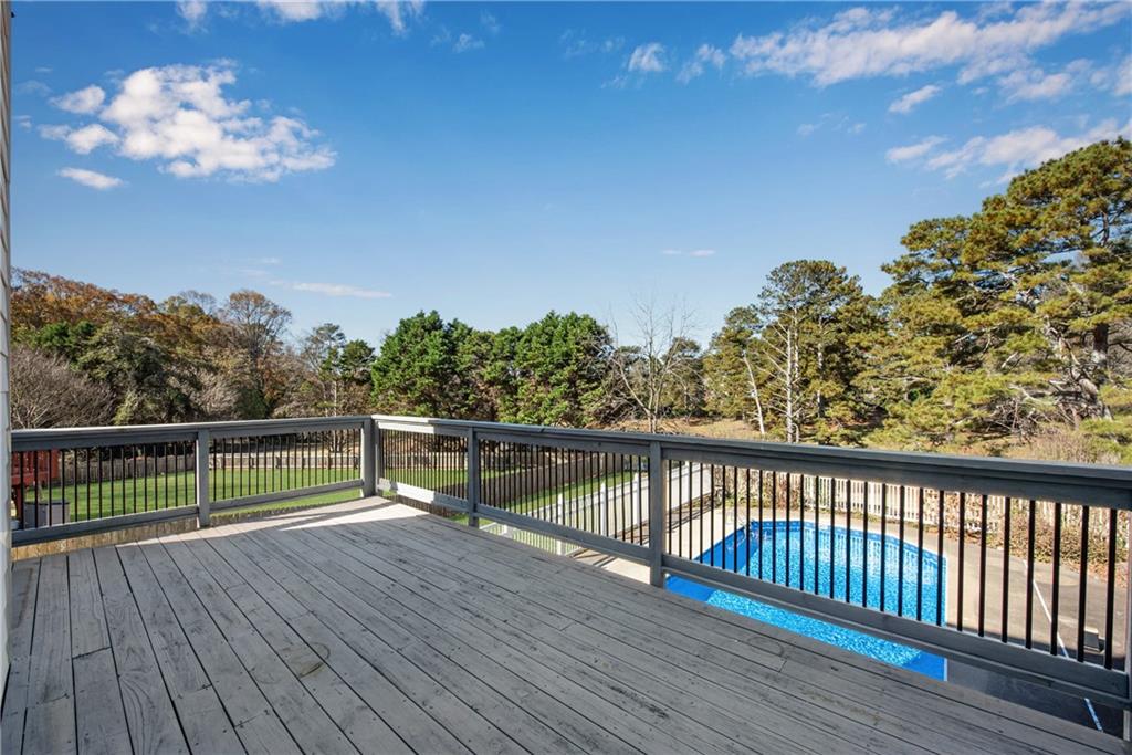 161 Brook Lane Roswell, GA 30075 - Photo 48 of 66 a view of a balcony with wooden floor