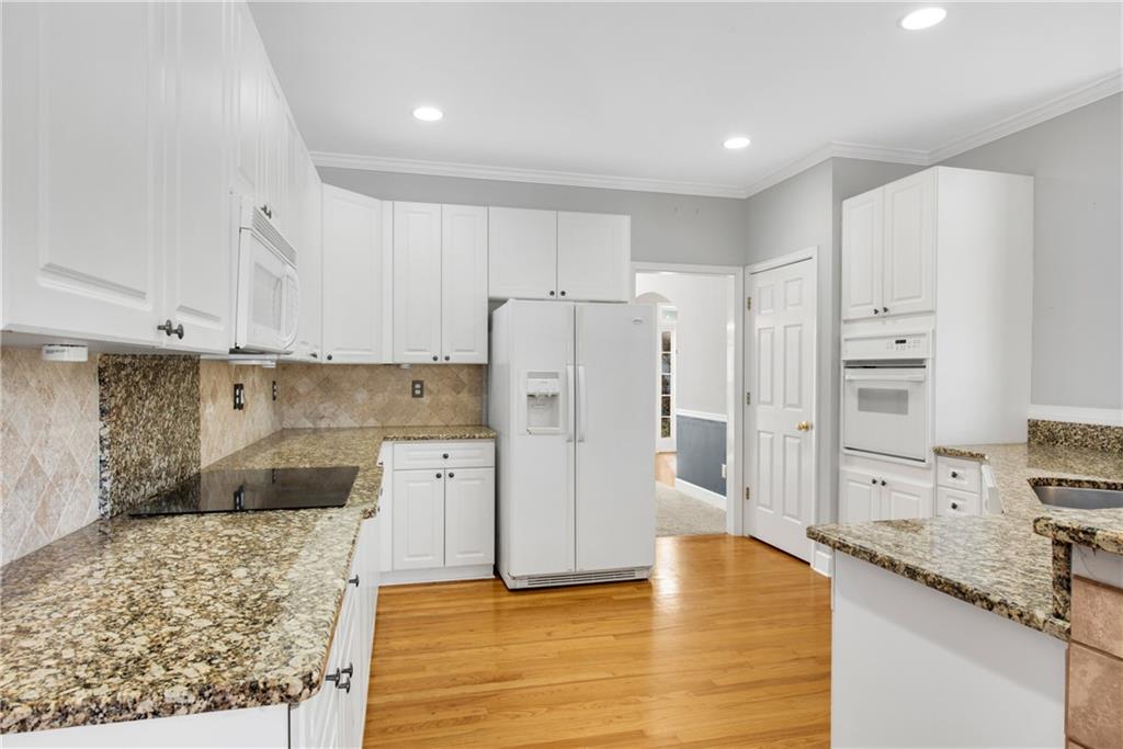 161 Brook Lane Roswell, GA 30075 - Photo 8 of 66 a kitchen with stainless steel appliances granite countertop a refrigerator and a stove