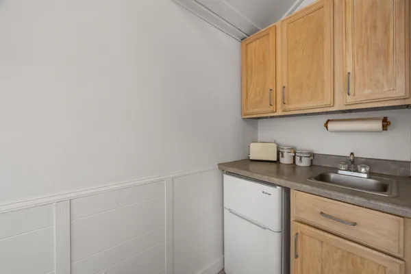 a kitchen with a sink and cabinets