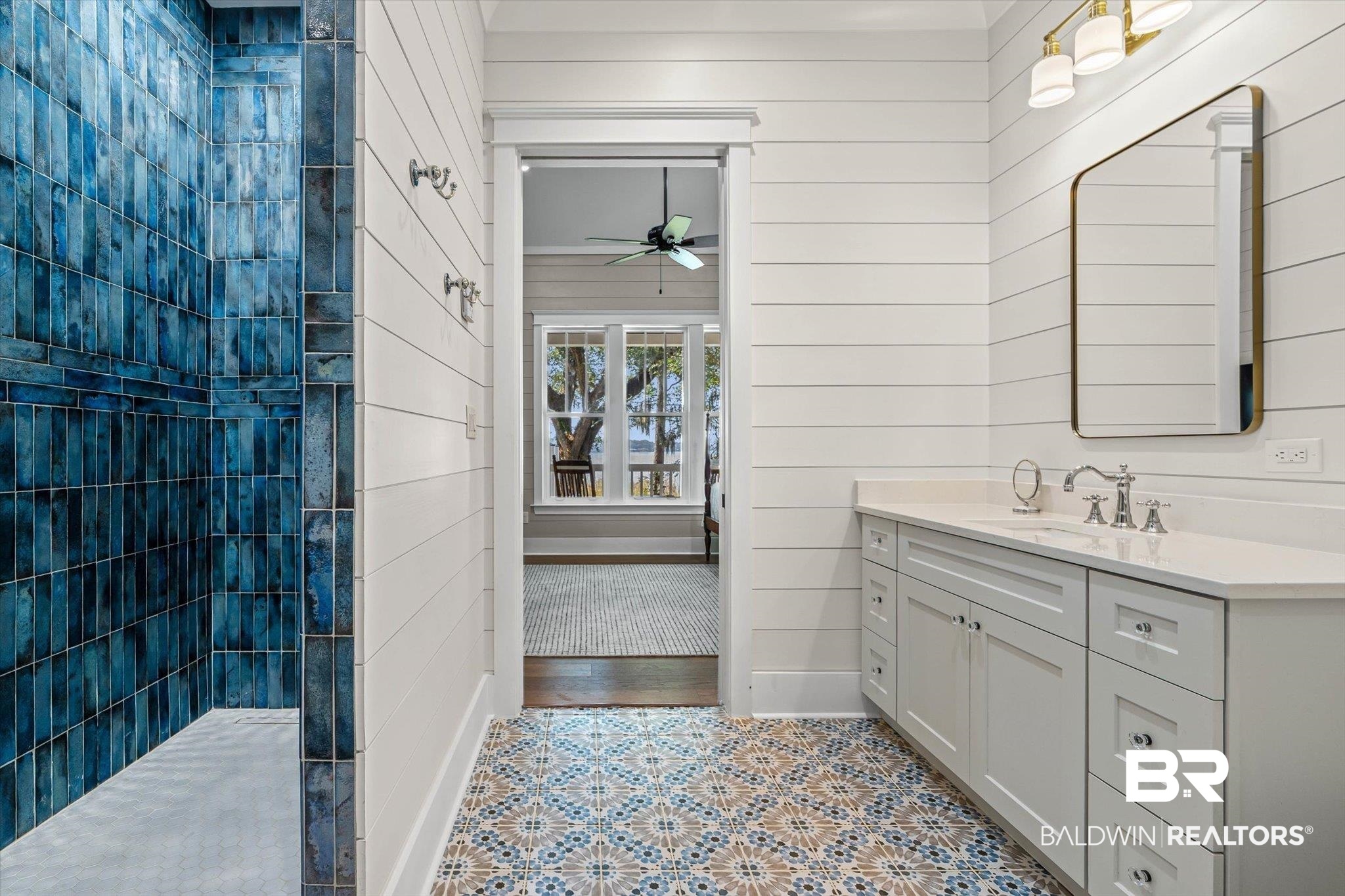 2415 Venetia Road Mobile, AL 36605 - Photo 19 of 50 Full bathroom with walk in shower, vanity, wooden walls, a ceiling fan, and light tile patterned floors