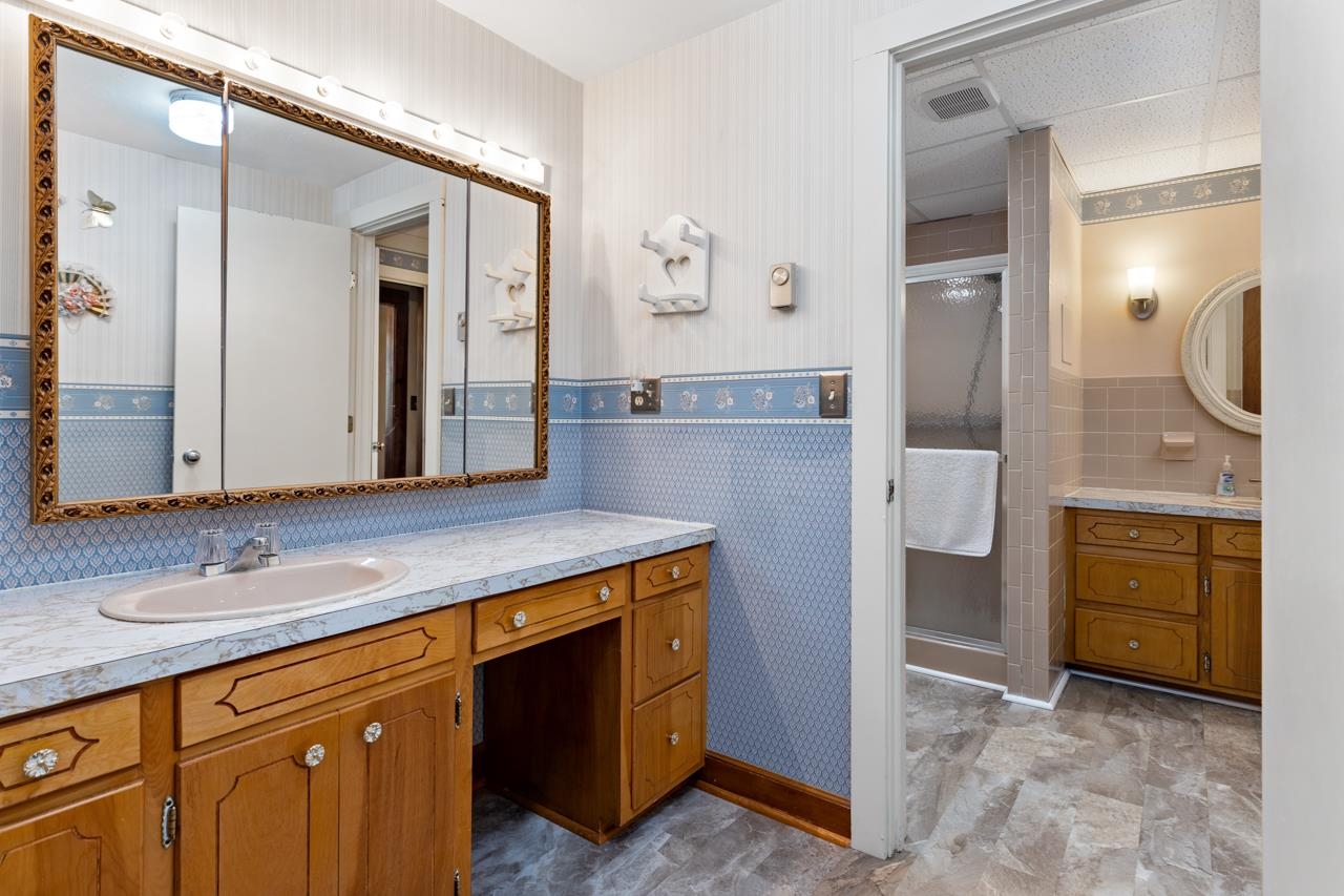 916 Union Church Road Churchville, VA 24421 - Photo 30 of 74 a bathroom with a granite countertop sink a mirror and a