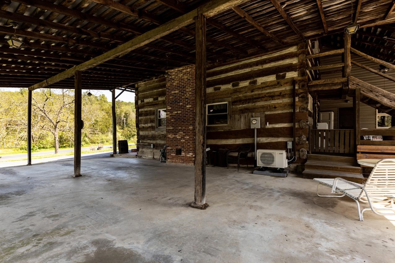 916 Union Church Road Churchville, VA 24421 - Photo 44 of 74 a view of an empty room with a fireplace and a floor to ceiling window