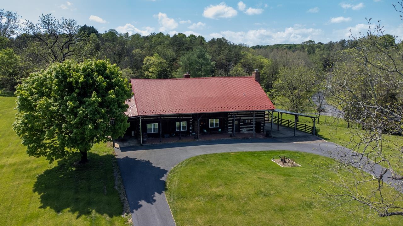 916 Union Church Road Churchville, VA 24421 - Photo 73 of 74 an aerial view of a house with swimming pool and trees all around