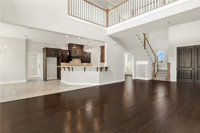 a view of a livingroom with furniture wooden floor and windows