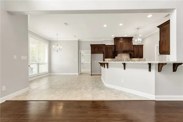 a view of living room with furniture and a flat screen tv