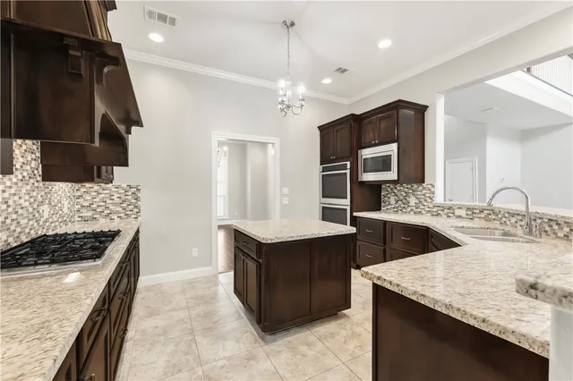 a kitchen with a stove and a sink