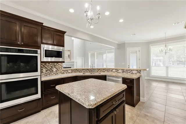 a kitchen with a stove and a microwave