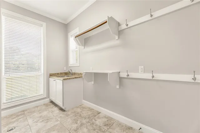 a view of storage and utility room with washer and dryer