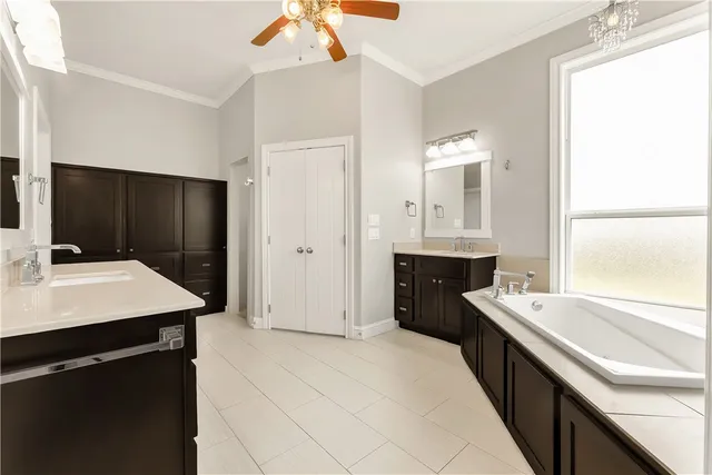a kitchen with a sink dishwasher a stove and a refrigerator with wooden floor