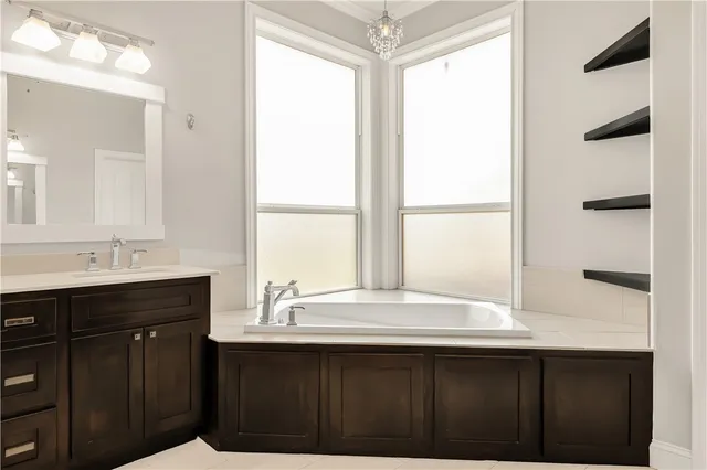 a bathroom with a sink and a window