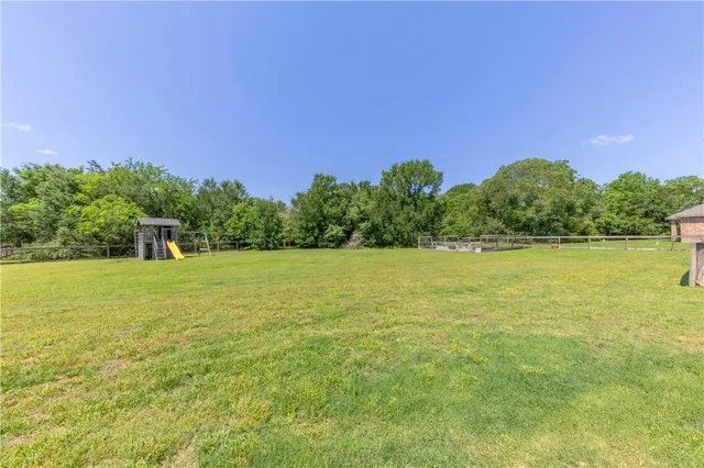 a view of a yard with a lake view