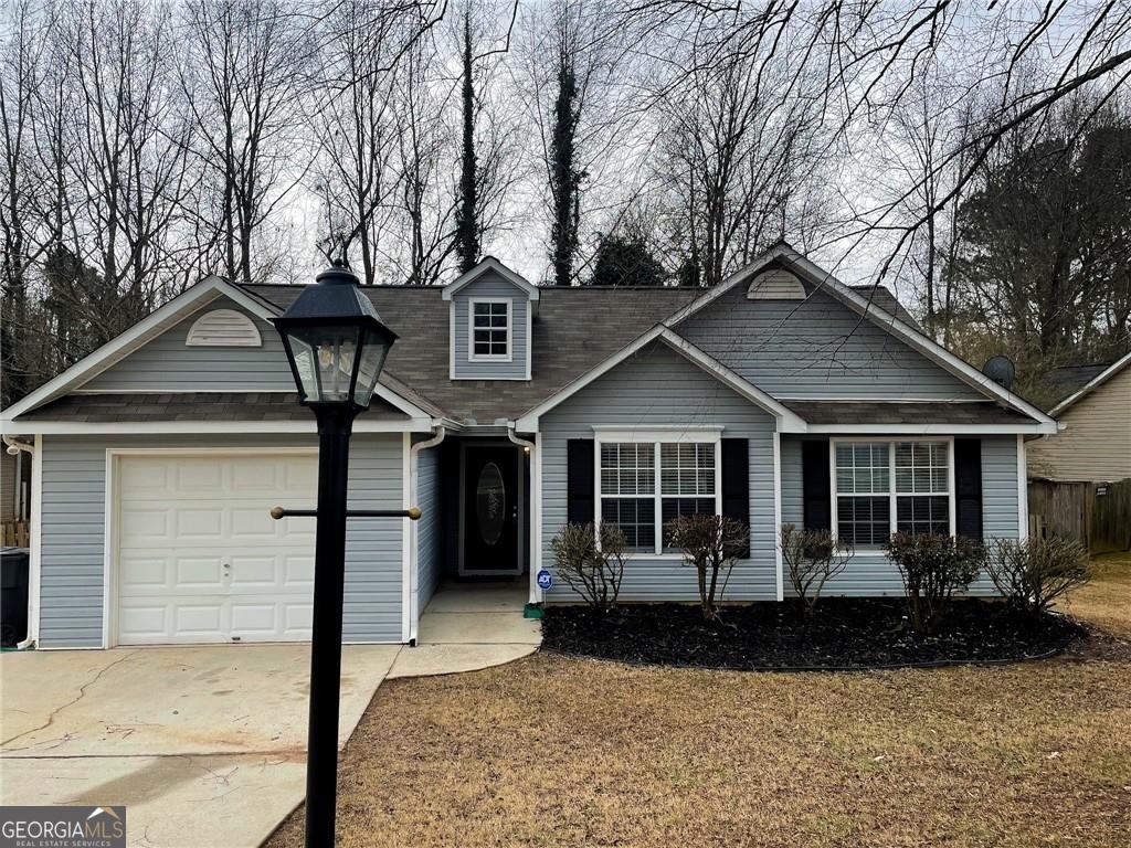 255 Misty Ridge Trail Stockbridge, GA 30281 - Photo 1 of 1 a front view of a house with garden