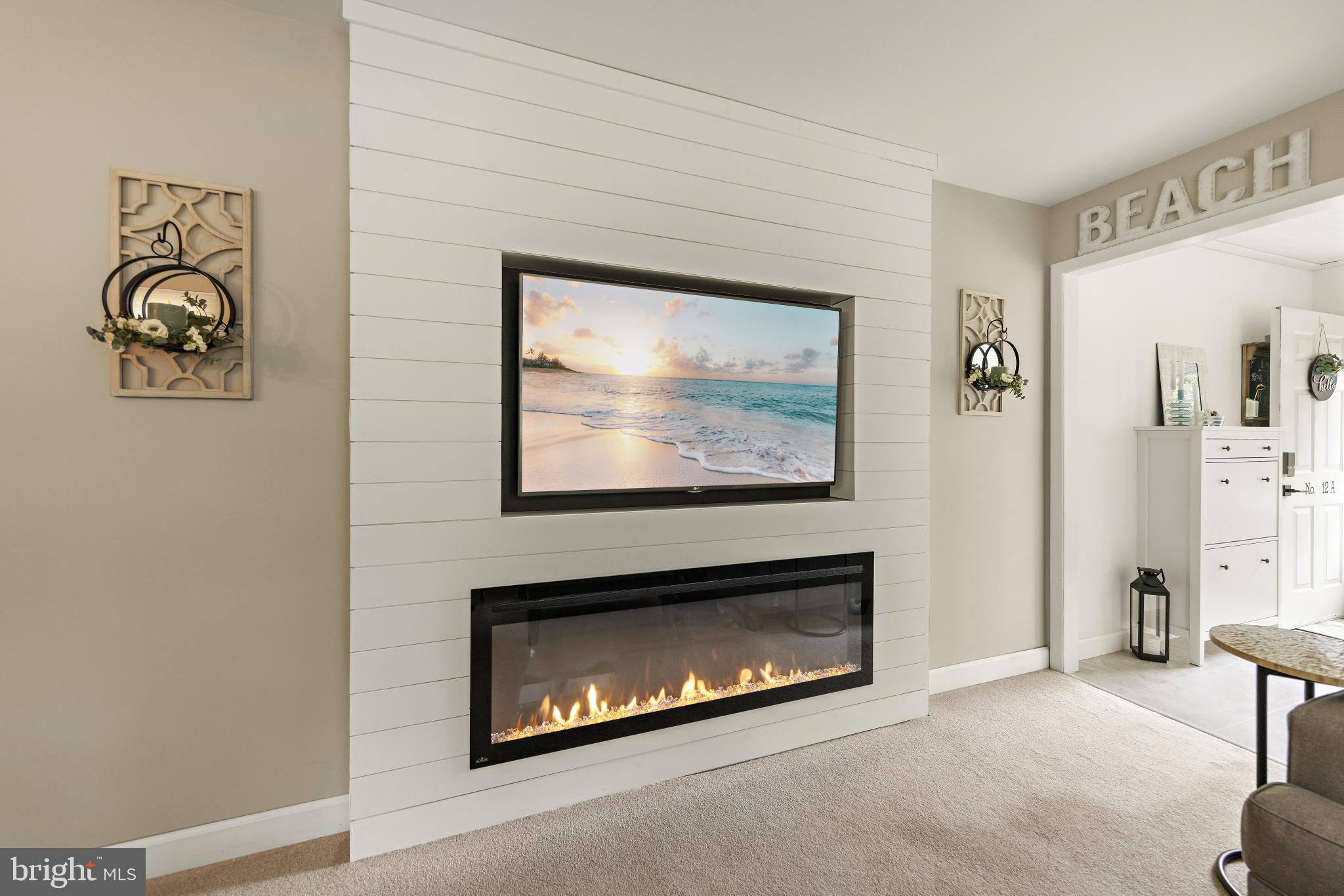 12 A Walnut Road Manahawkin, NJ 08050 - Photo 7 of 25 Custom shiplap paneled electric fireplace