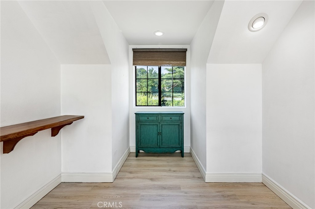 15601 Saddleback Road Canyon Country, CA 91387 - Photo 31 of 55 an empty room with wooden floor and a window