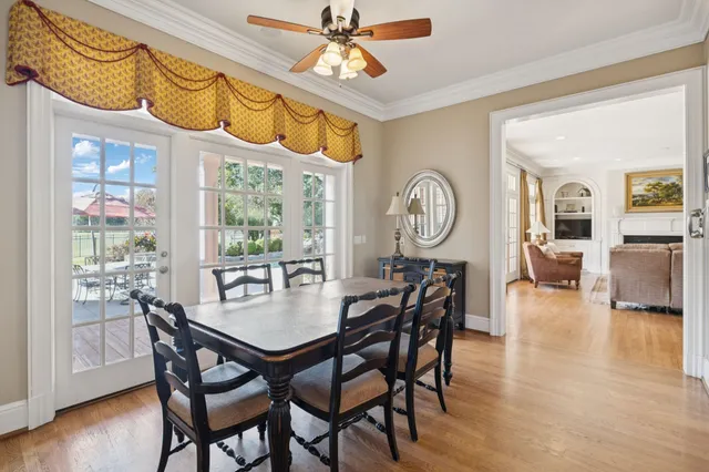 a bathroom with a granite countertop sink and a large mirror