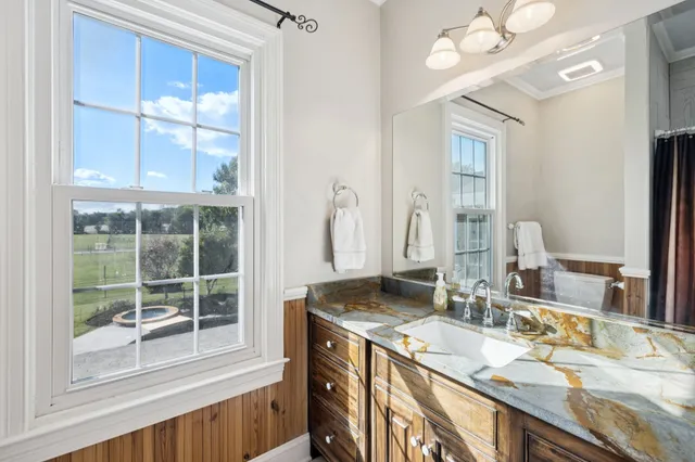 a kitchen with stainless steel appliances granite countertop a sink stove and wooden floor