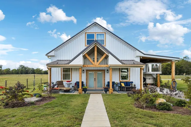 a view of a golf course with an ocean