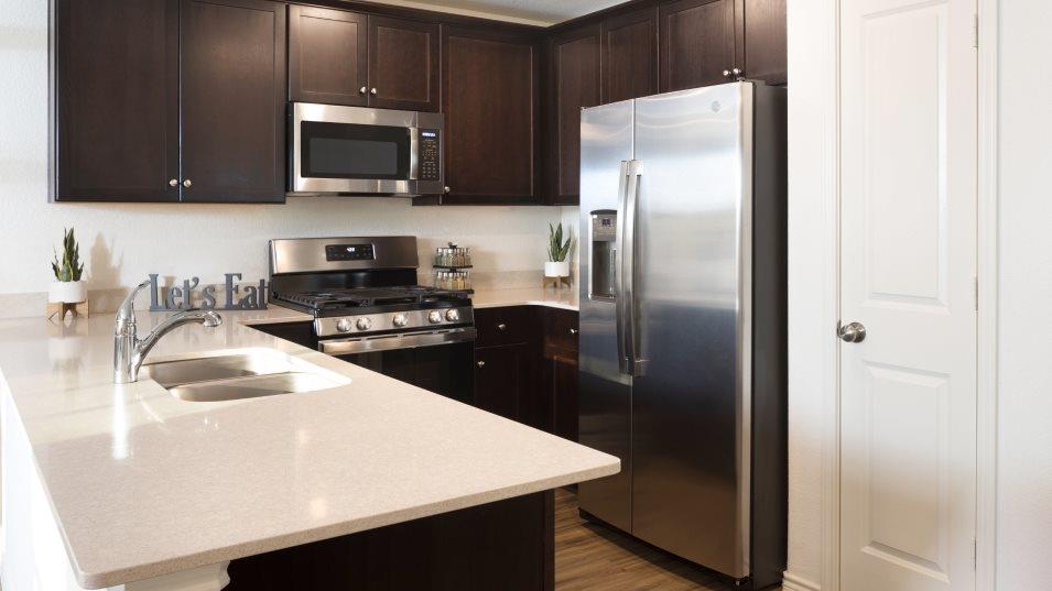 215 Bugbee Kyle, TX 78640 - Photo 2 of 13 a kitchen with a refrigerator sink and microwave