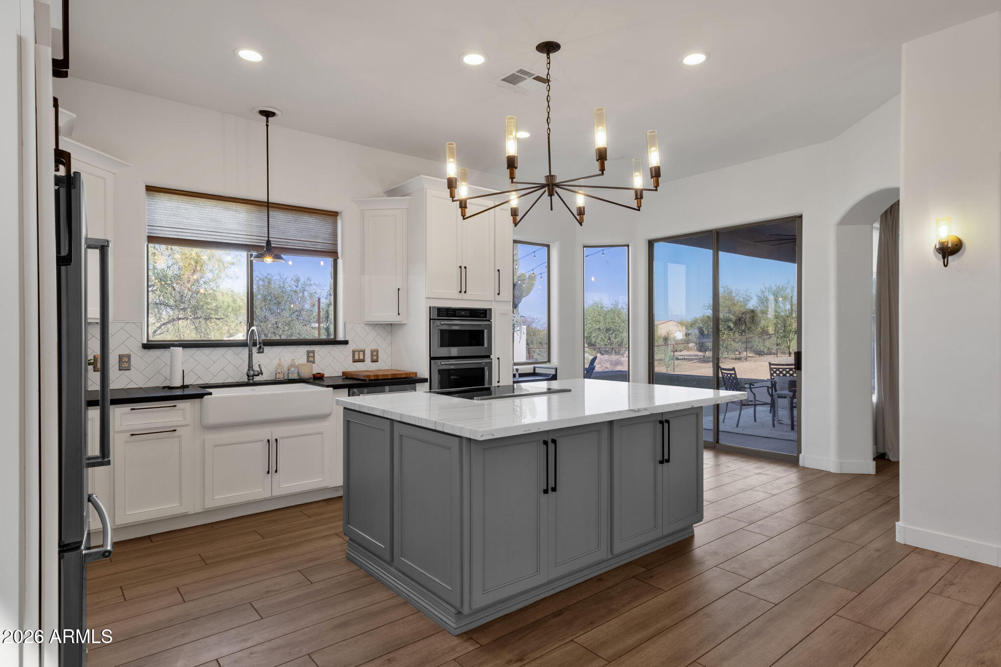 14604 East Peak View Road Scottsdale, AZ 85262 - Photo 12 of 55 a kitchen with stainless steel appliances granite countertop a sink a stove and a refrigerator