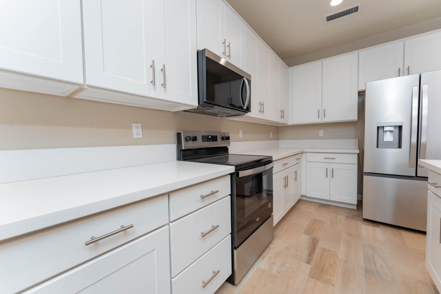 30480 Bellwood Road Visalia, CA 93291 - Photo 11 of 37 a kitchen with cabinets stainless steel appliances and a counter space