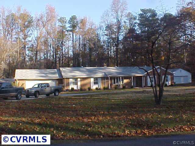 3810 Centralia Road Chester, VA 23831 - Photo 1 of 1 a front view of a house with a yard and trees