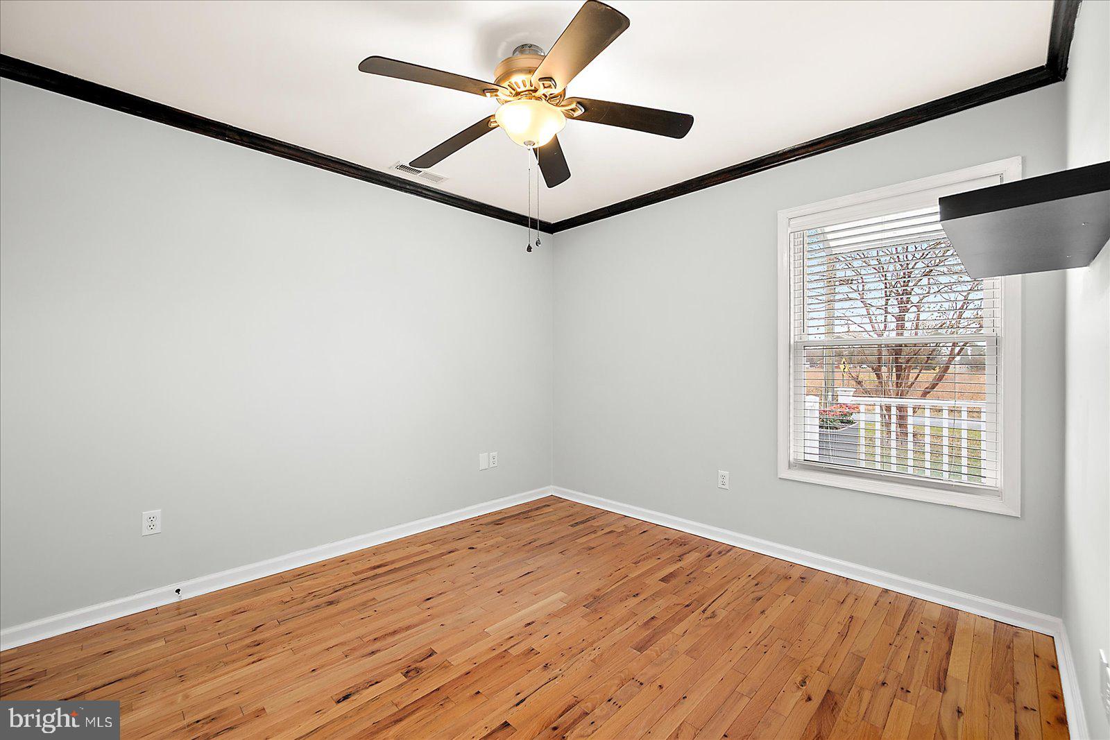36405 Poplar Neck Road Willards, MD 21874 - Photo 29 of 50 wooden floor in an empty room with a window