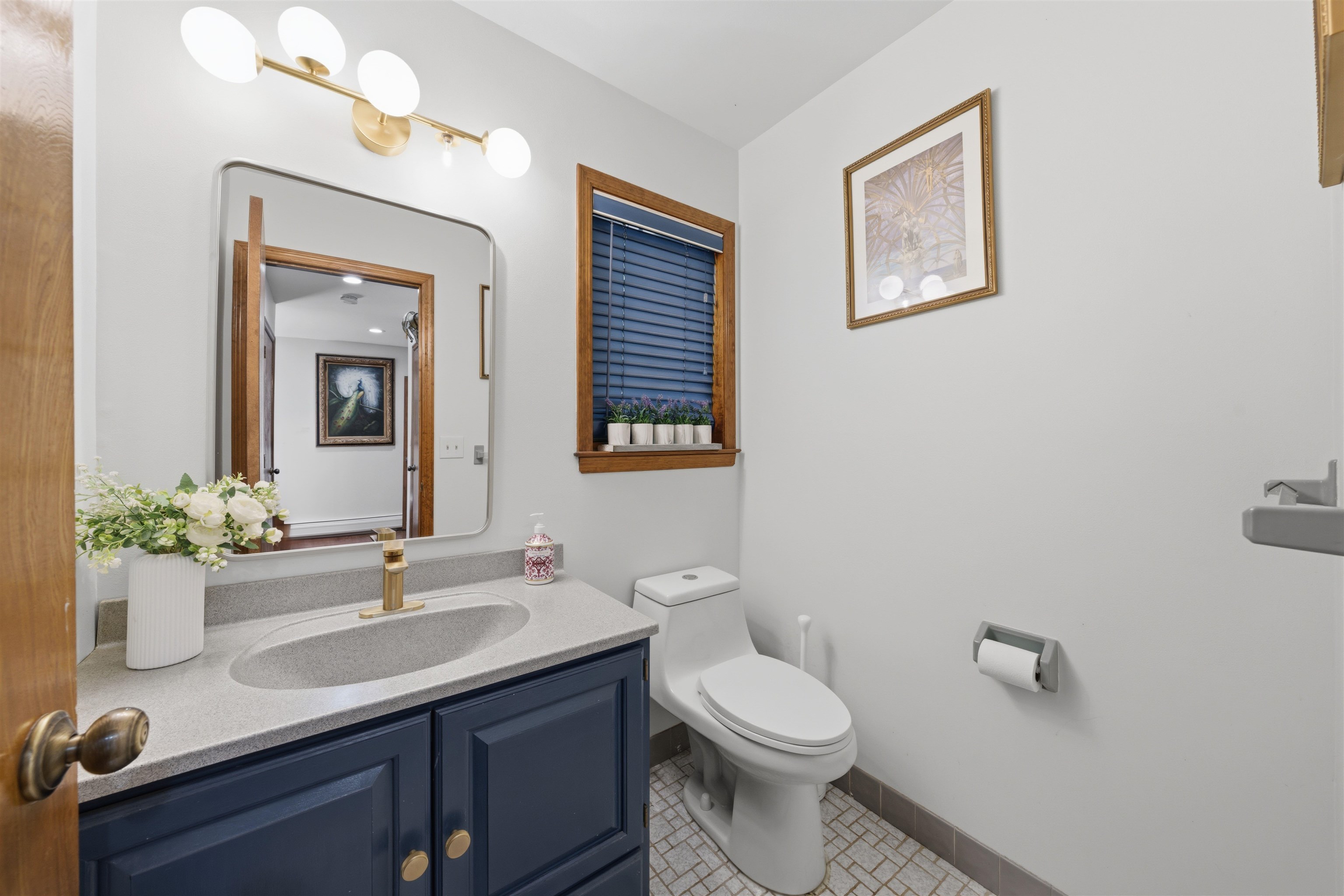 2 Carol Road Butler, NJ 07405 - Photo 18 of 49 a bathroom with a toilet a sink and mirror