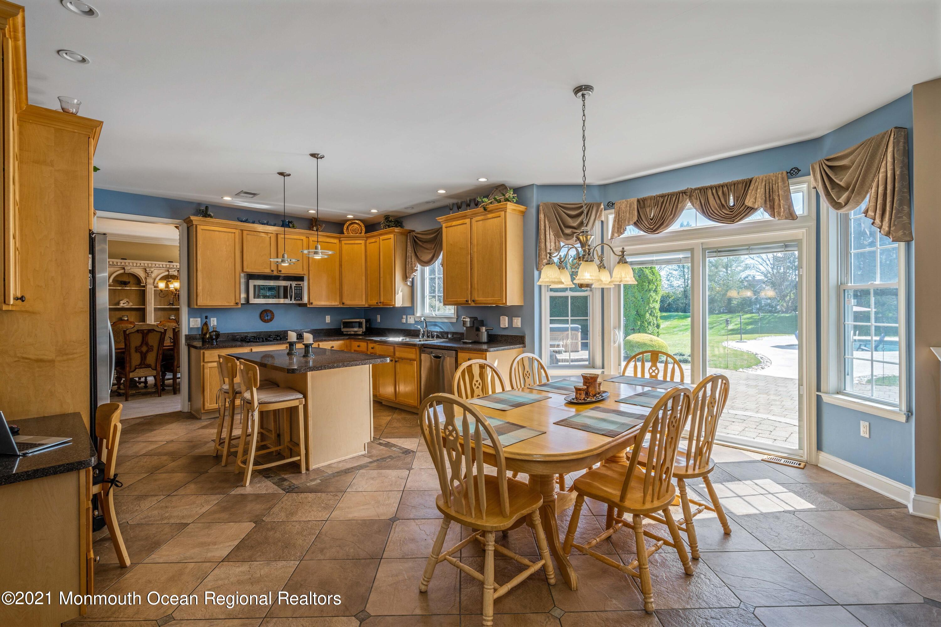 5 Michael Drive Cream Ridge, NJ 08514 - Photo 11 of 69 a dining room with furniture a chandelier and kitchen view