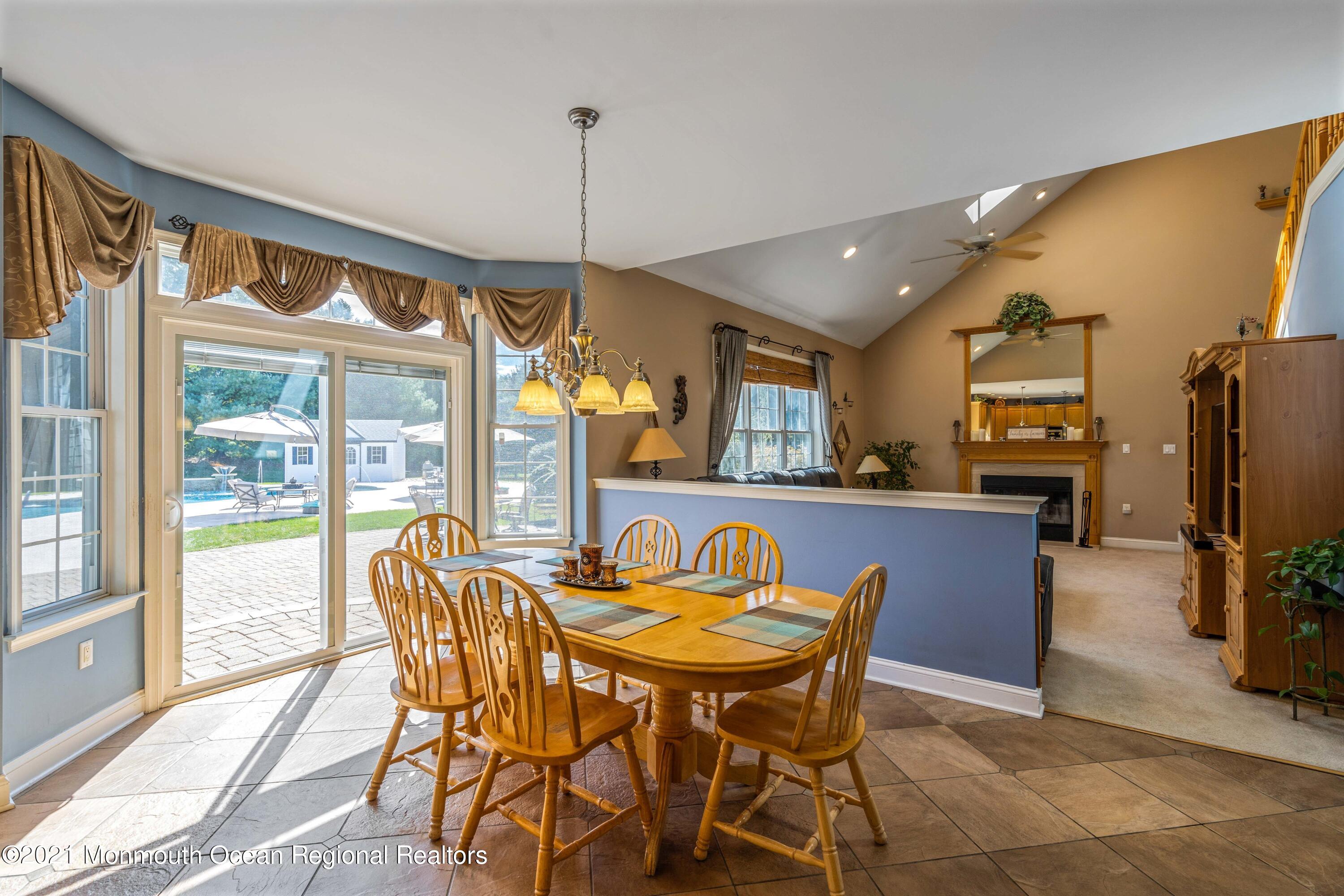 5 Michael Drive Cream Ridge, NJ 08514 - Photo 12 of 69 a dining room with furniture and a floor to ceiling window