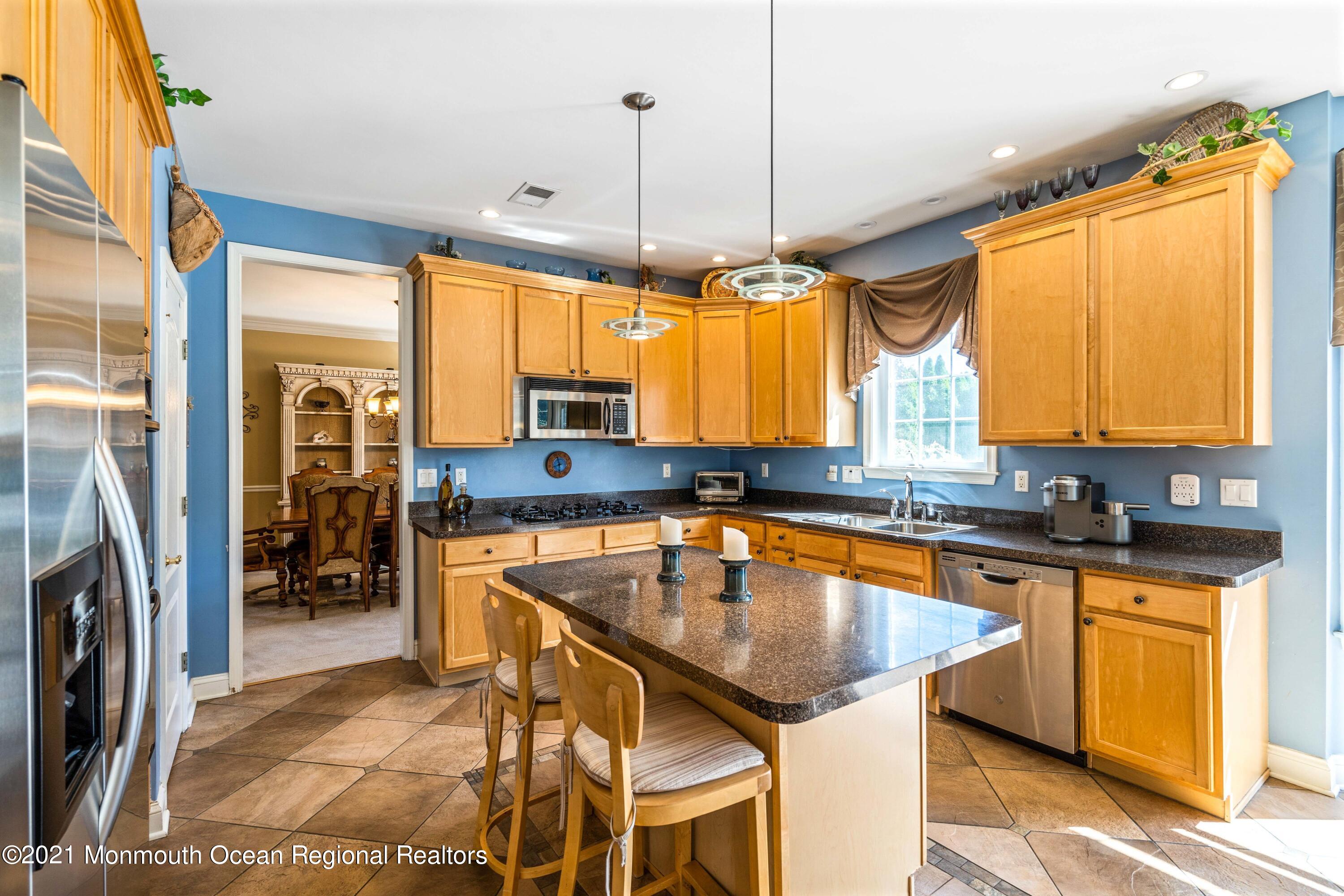 5 Michael Drive Cream Ridge, NJ 08514 - Photo 14 of 69 a kitchen with stainless steel appliances granite countertop a refrigerator a sink a stove and island