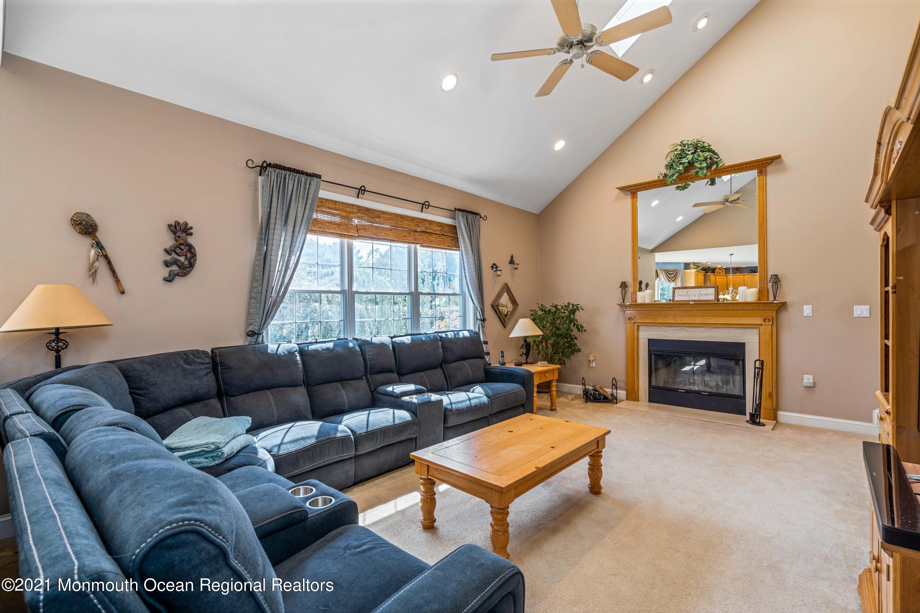 5 Michael Drive Cream Ridge, NJ 08514 - Photo 21 of 69 a living room with furniture a fireplace and a large window