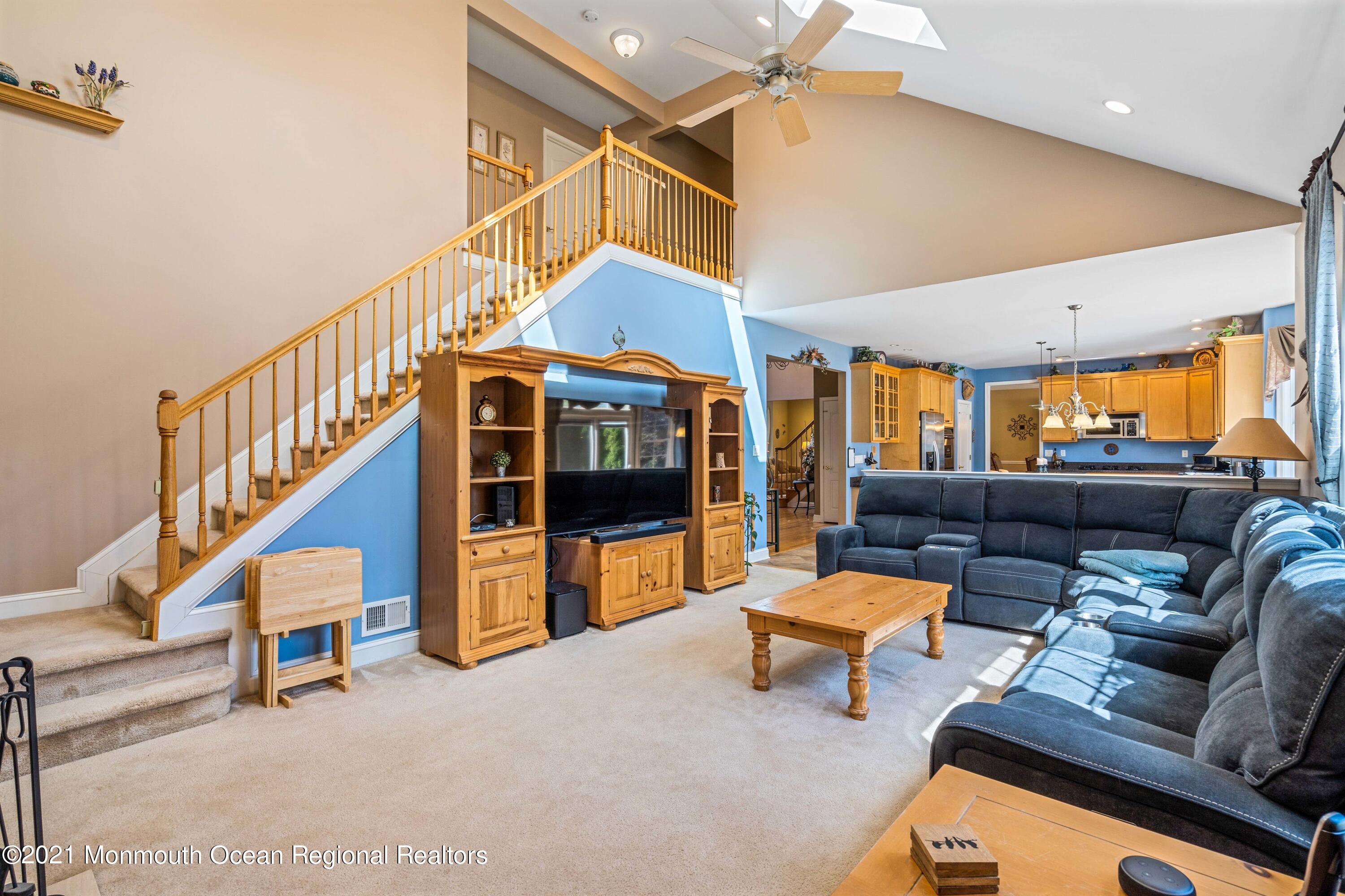 5 Michael Drive Cream Ridge, NJ 08514 - Photo 23 of 69 a living room with furniture and a chandelier