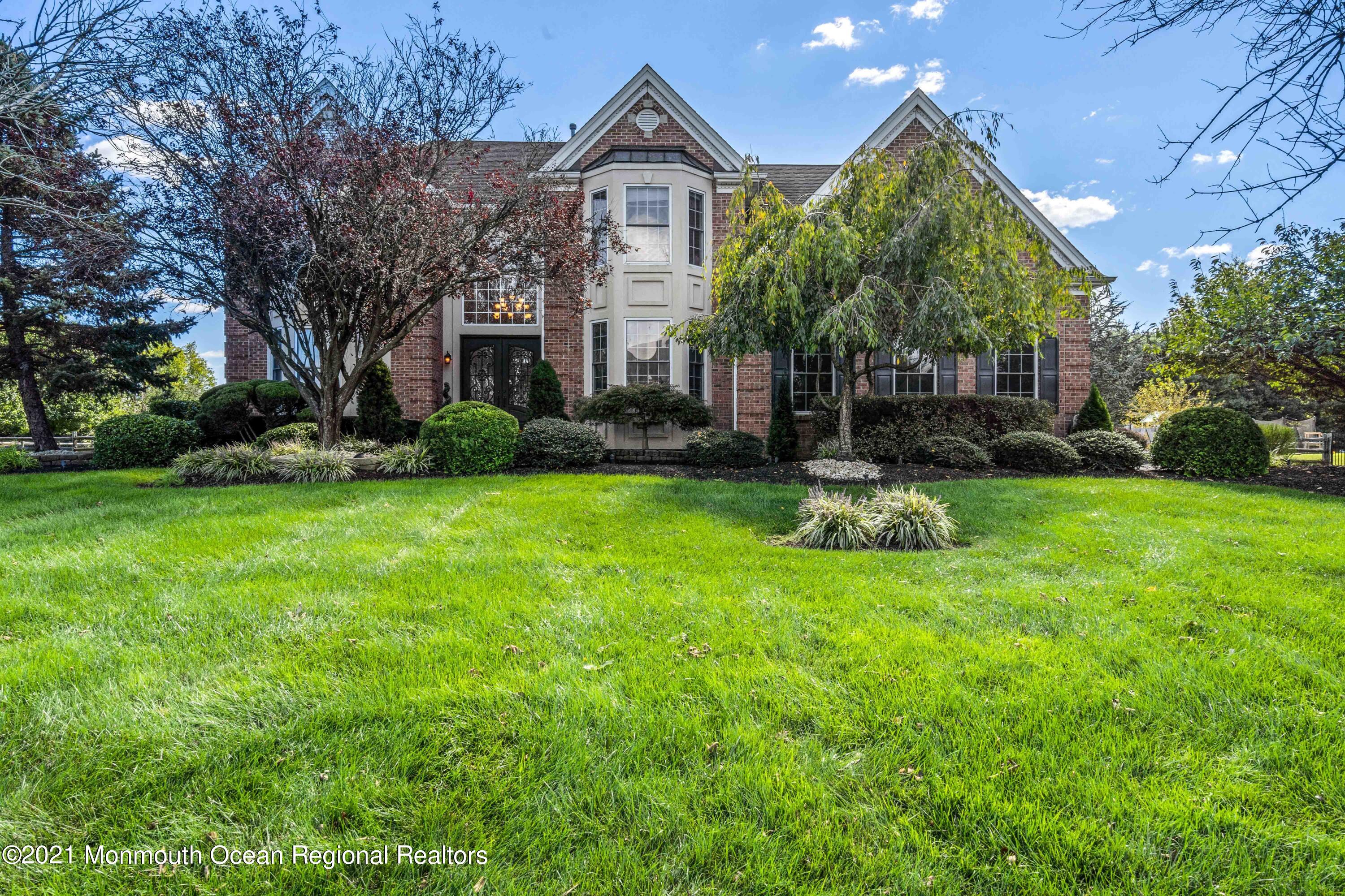 5 Michael Drive Cream Ridge, NJ 08514 - Photo 4 of 69 a front view of a house with garden