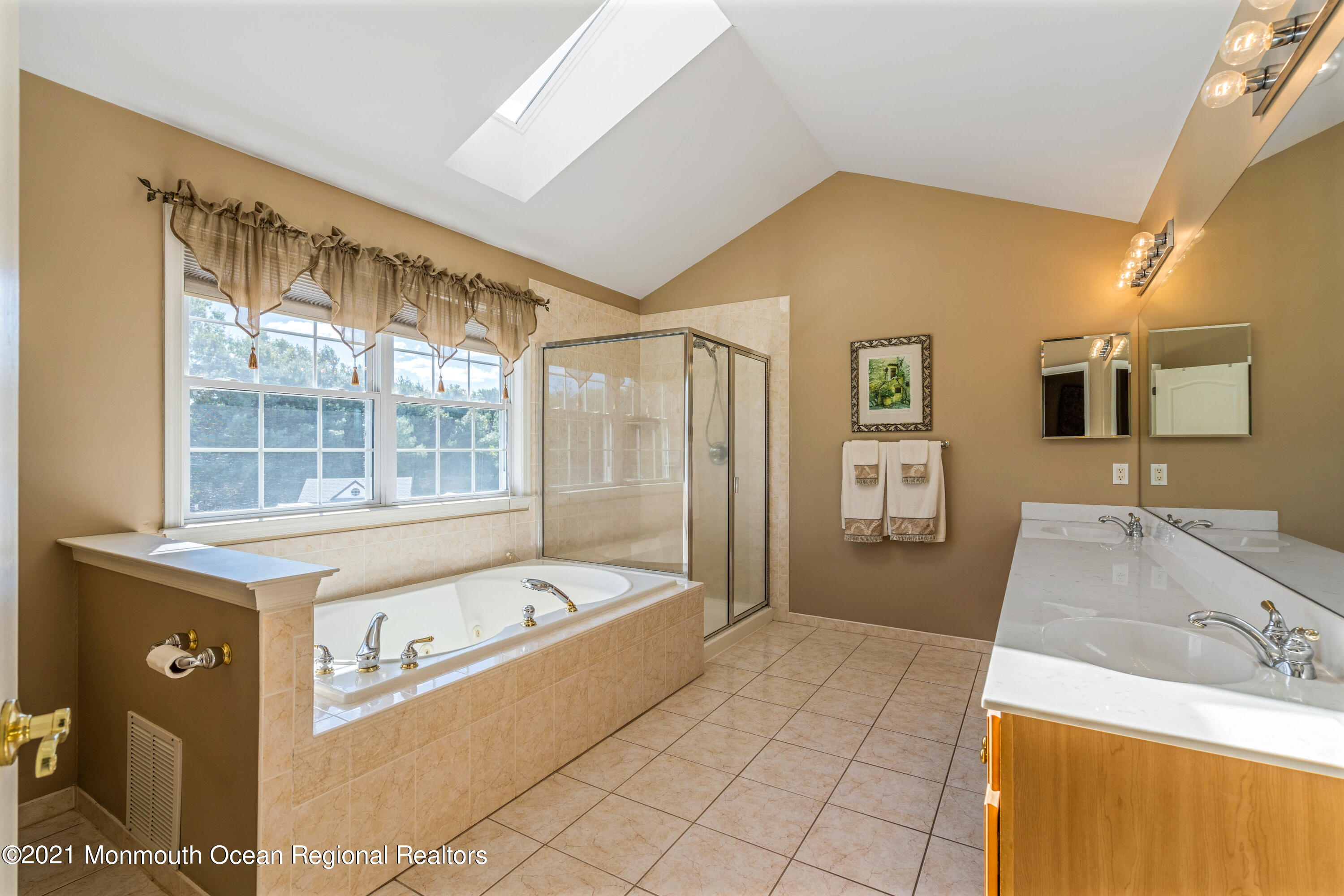 5 Michael Drive Cream Ridge, NJ 08514 - Photo 31 of 69 a bathroom with a tub a sink and a large mirror
