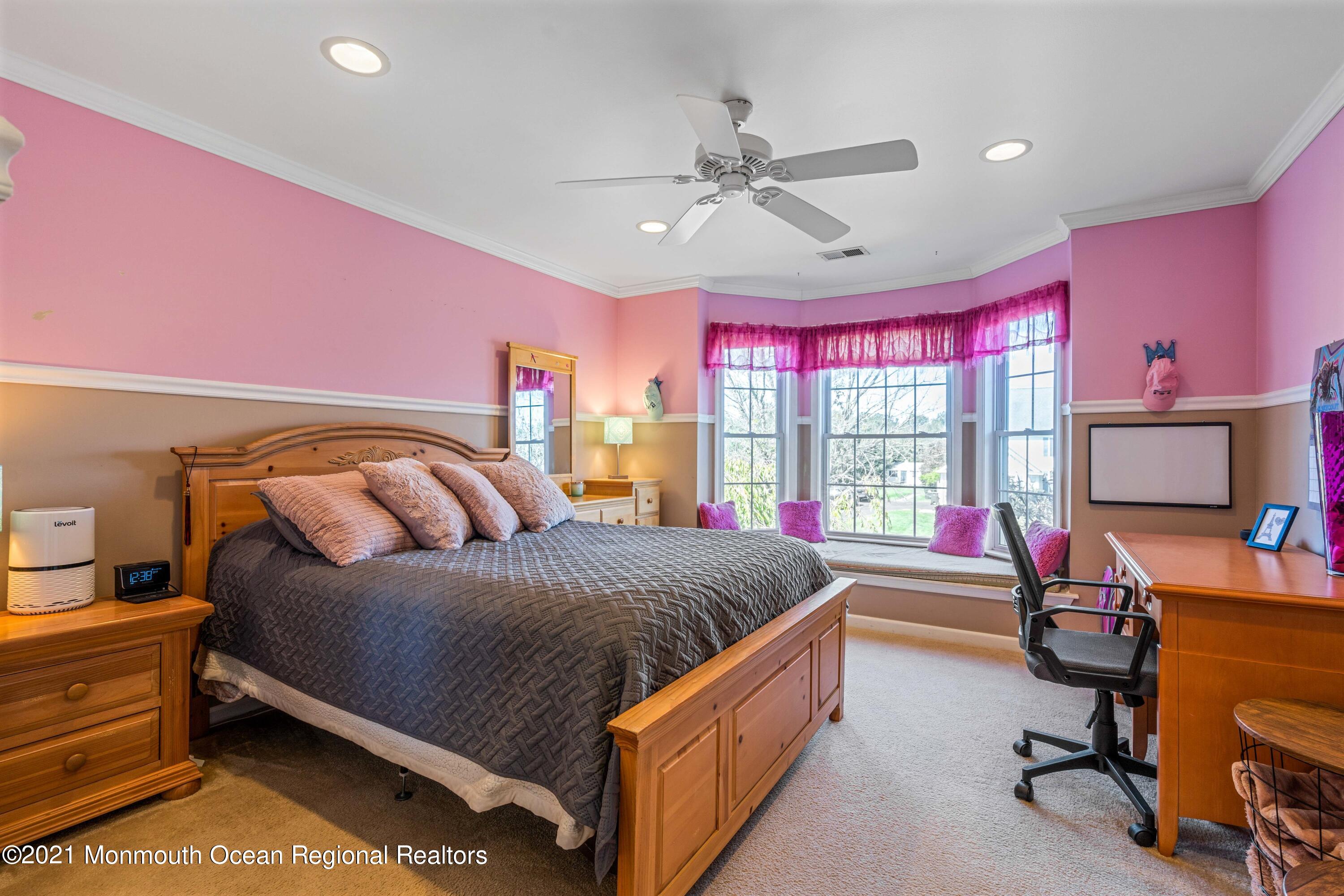 5 Michael Drive Cream Ridge, NJ 08514 - Photo 33 of 69 a bed room with a bed and a chandelier
