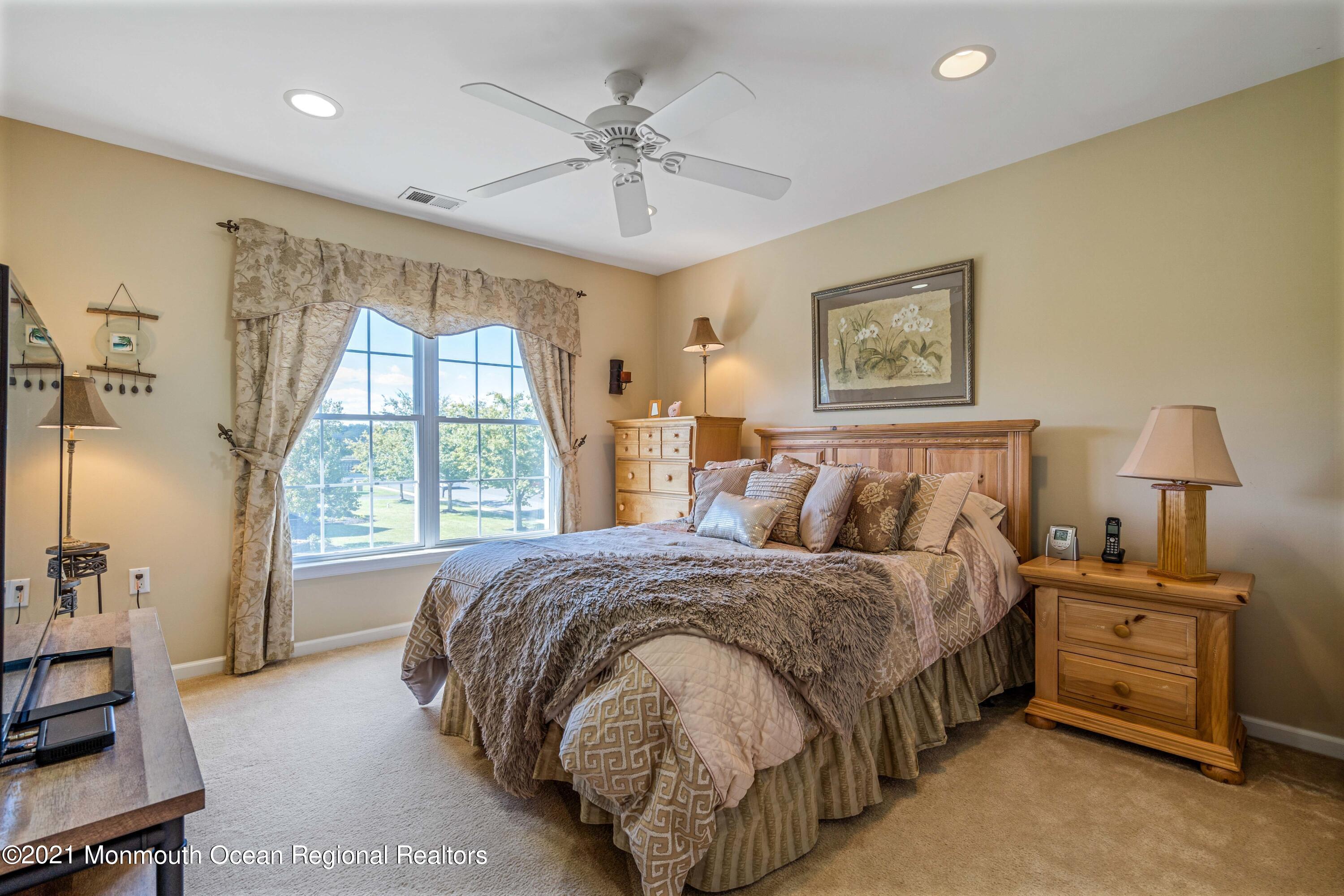 5 Michael Drive Cream Ridge, NJ 08514 - Photo 34 of 69 a spacious bedroom with a bed and a window