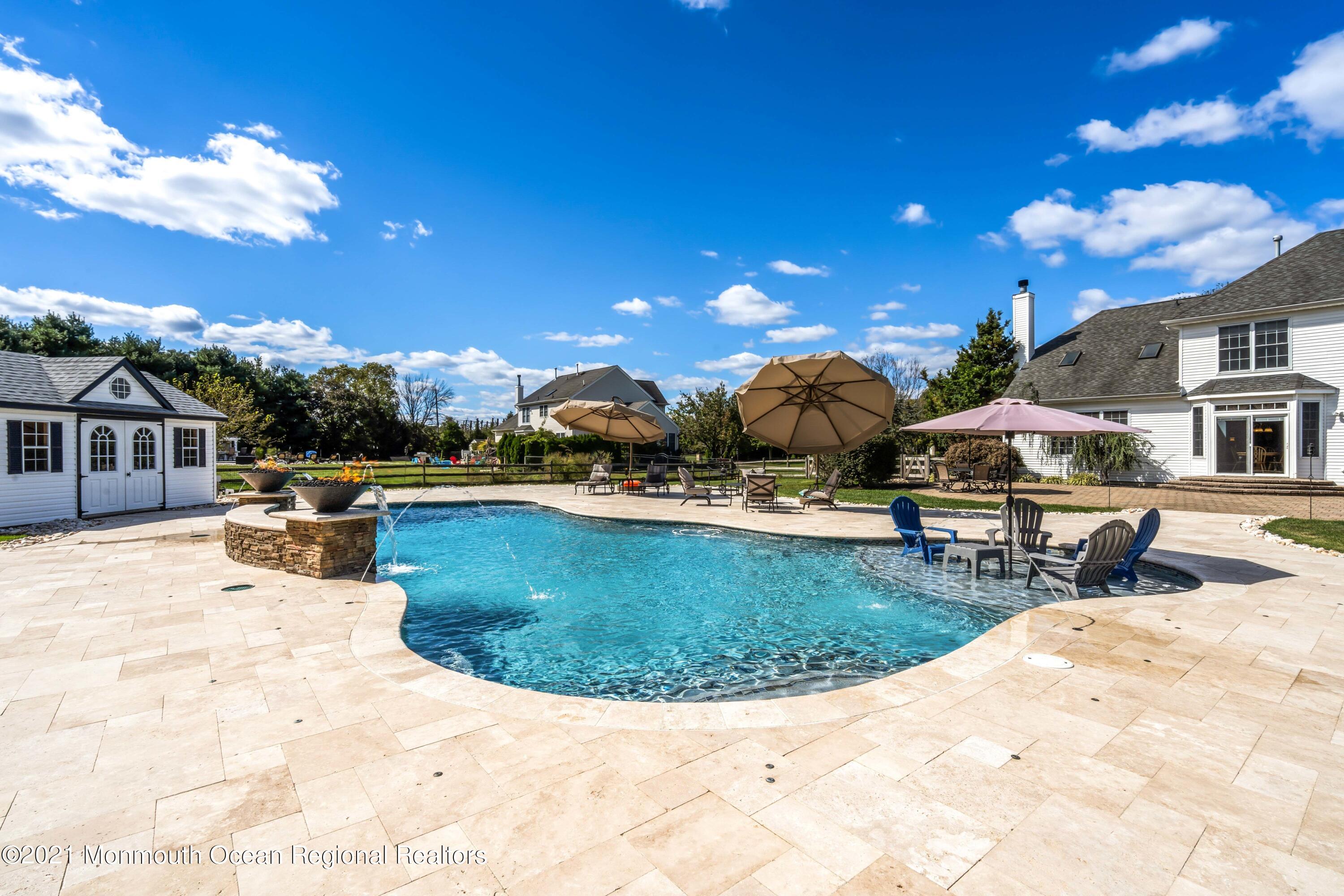 5 Michael Drive Cream Ridge, NJ 08514 - Photo 38 of 69 a view of a swimming pool with sitting area