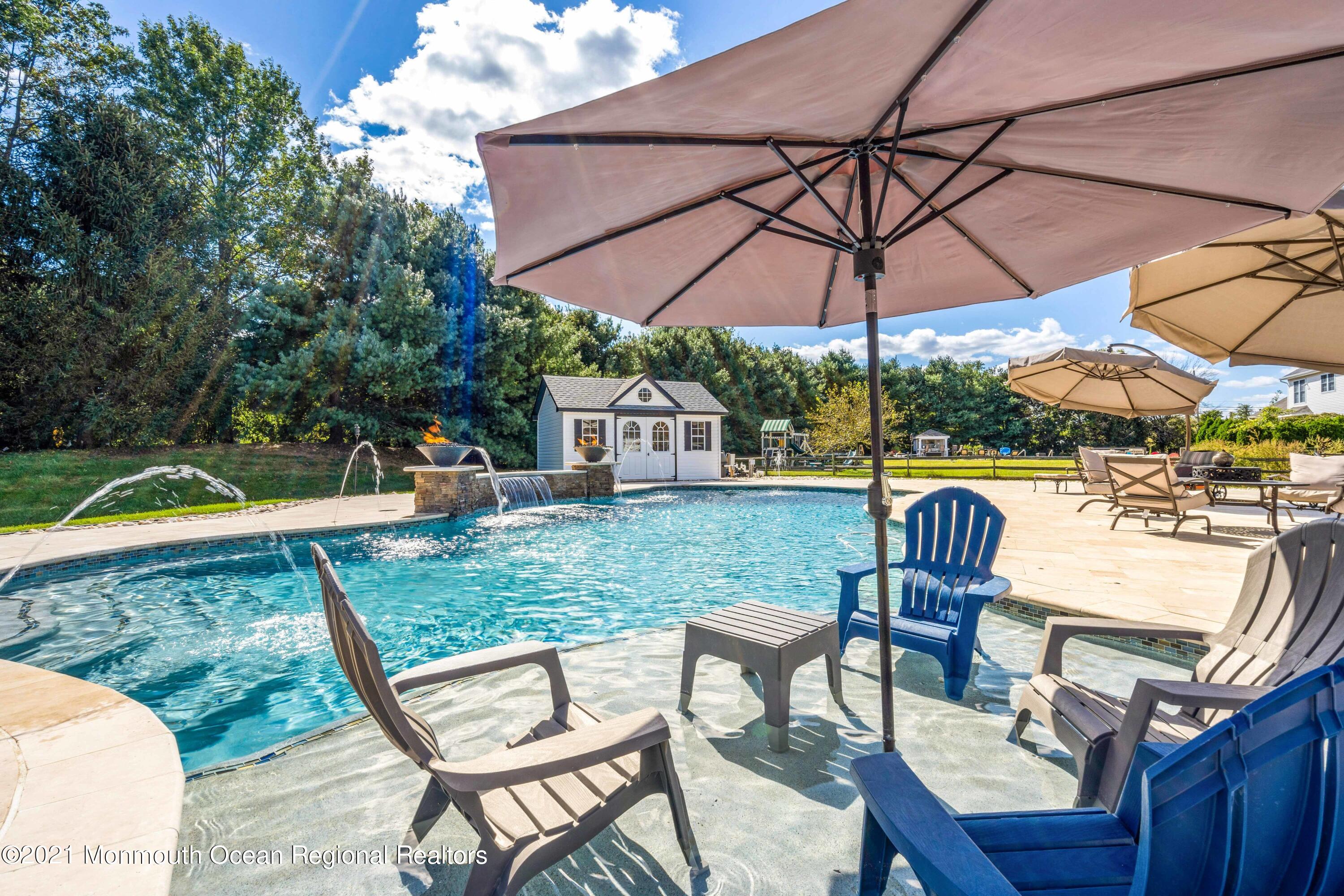 5 Michael Drive Cream Ridge, NJ 08514 - Photo 39 of 69 a view of a chair and table in the backyard