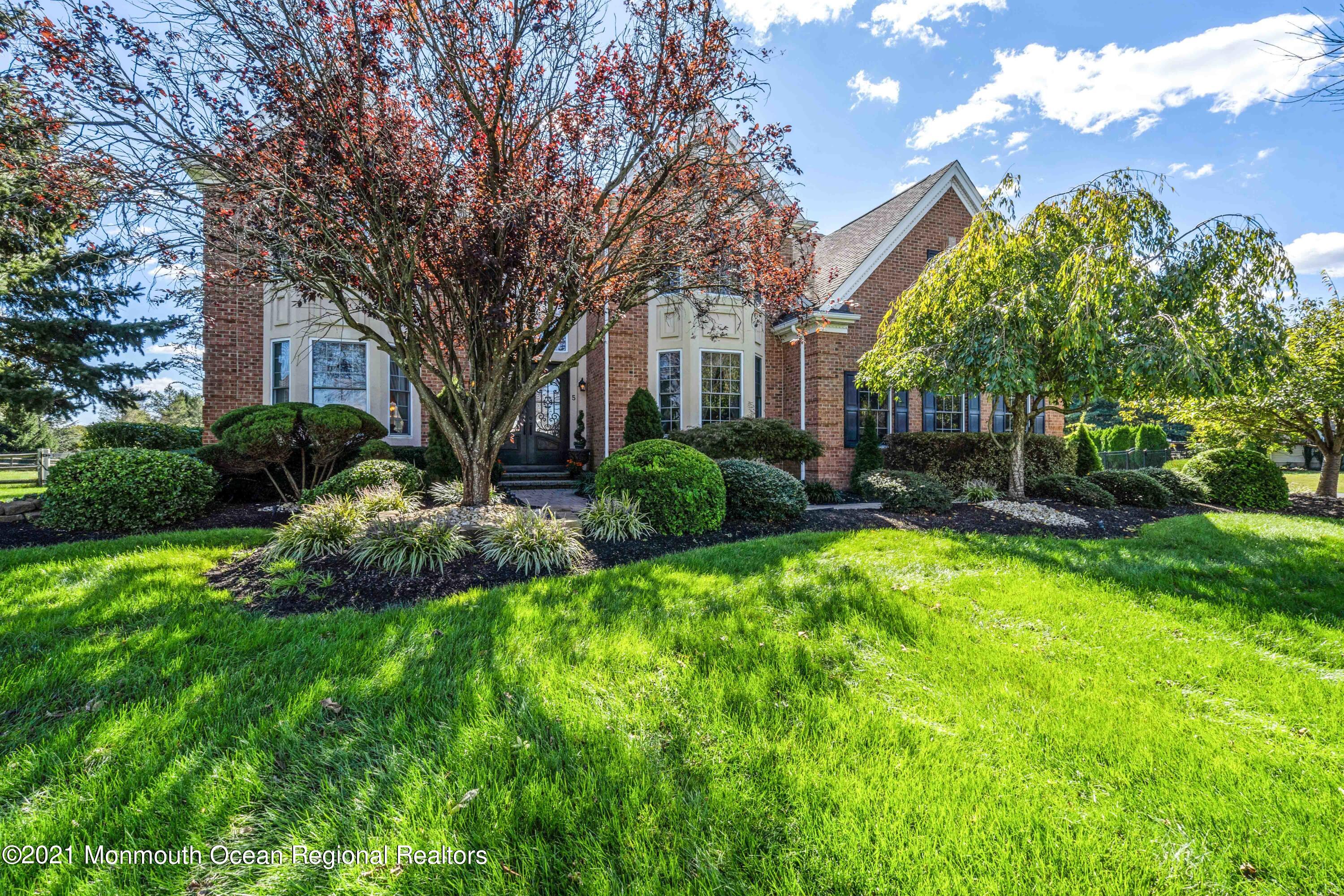 5 Michael Drive Cream Ridge, NJ 08514 - Photo 5 of 69 a front view of a house with a yard and tree s