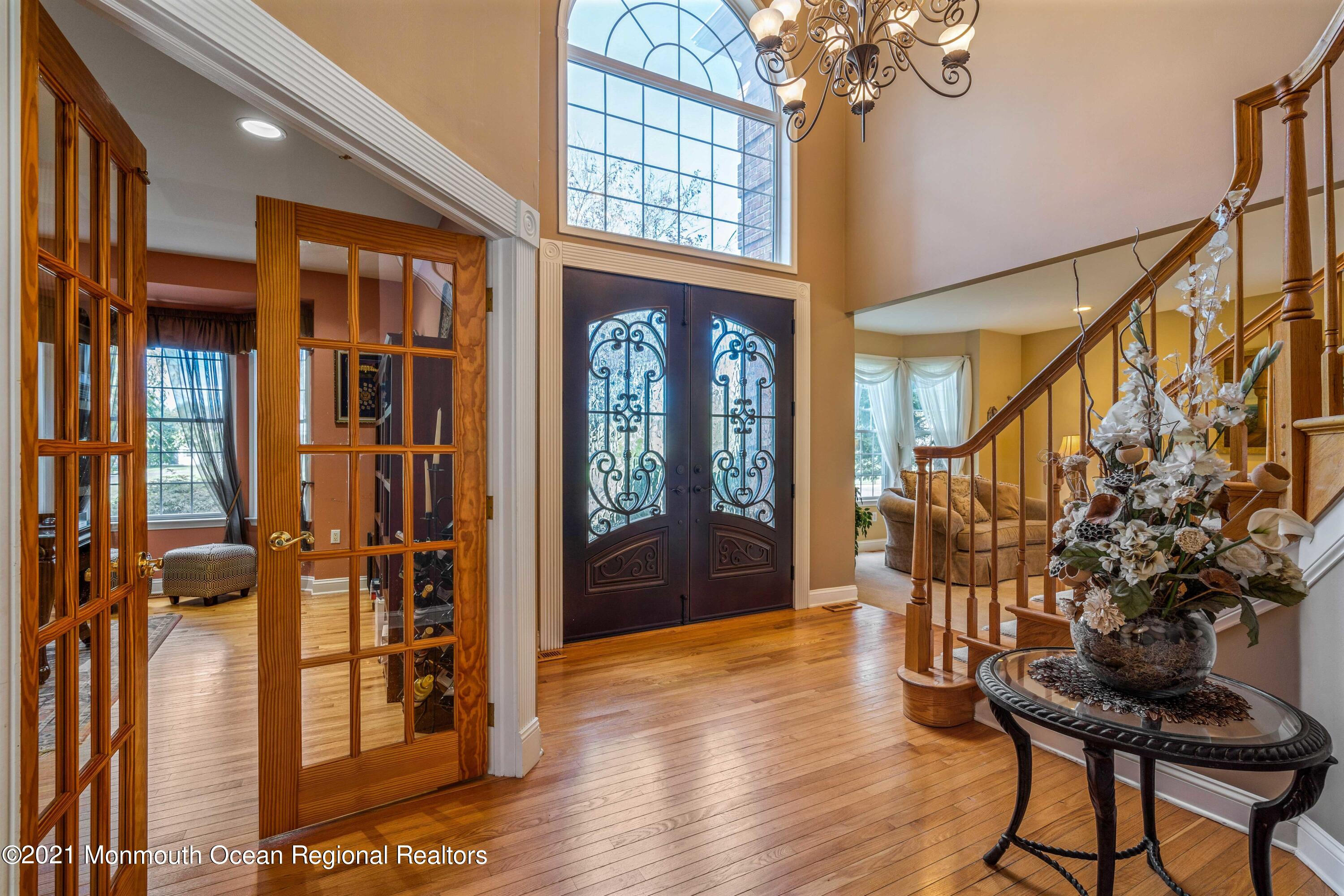 5 Michael Drive Cream Ridge, NJ 08514 - Photo 6 of 69 a view of an entryway with wooden floor and windows