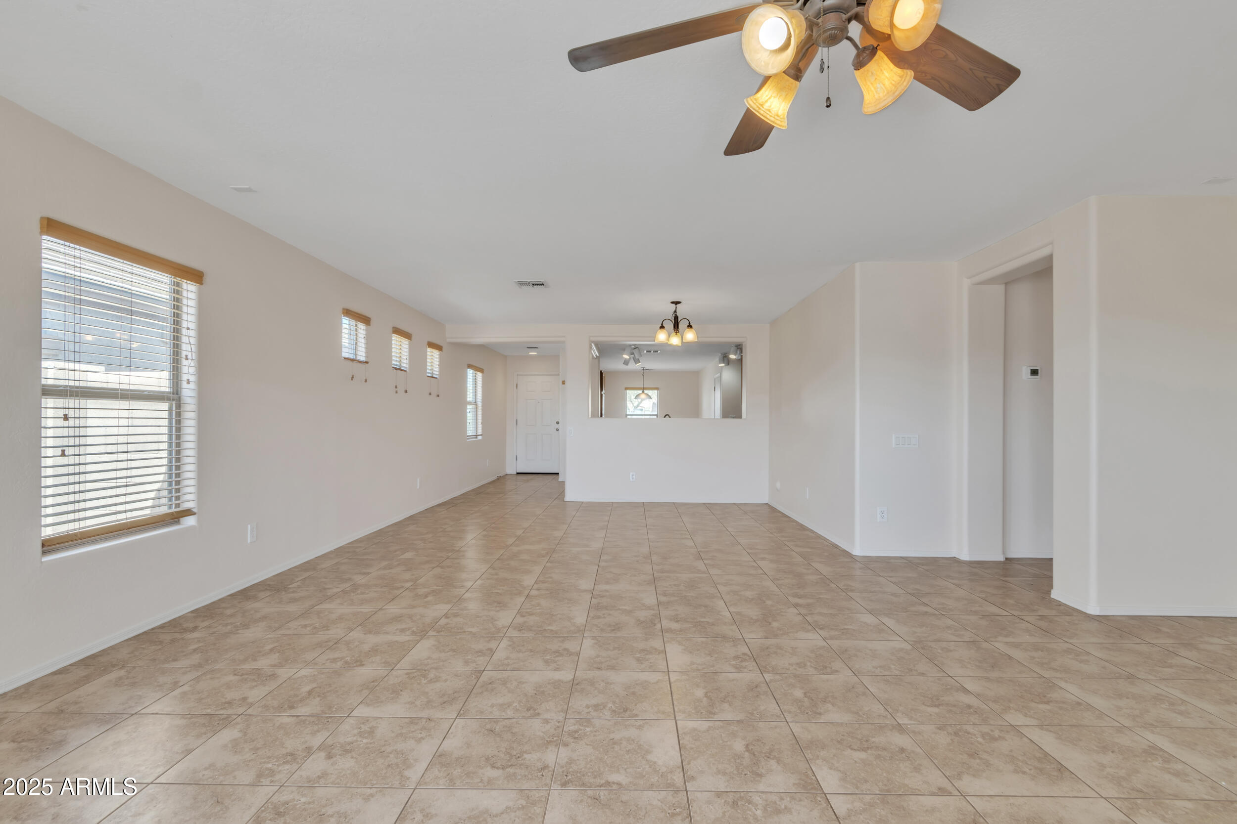 43849 West Cowpath Road Maricopa, AZ 85138 - Photo 23 of 42 a view of an empty room with a window