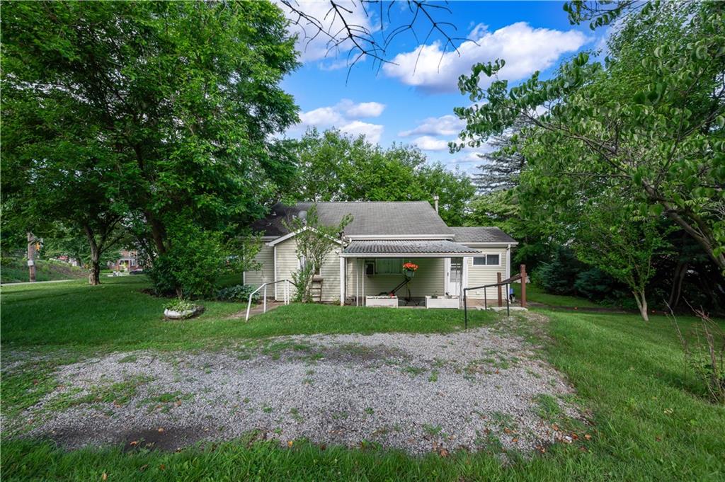 411 Harmony Road Baden, PA 15005 - Photo 21 of 25 a front view of a house with garden