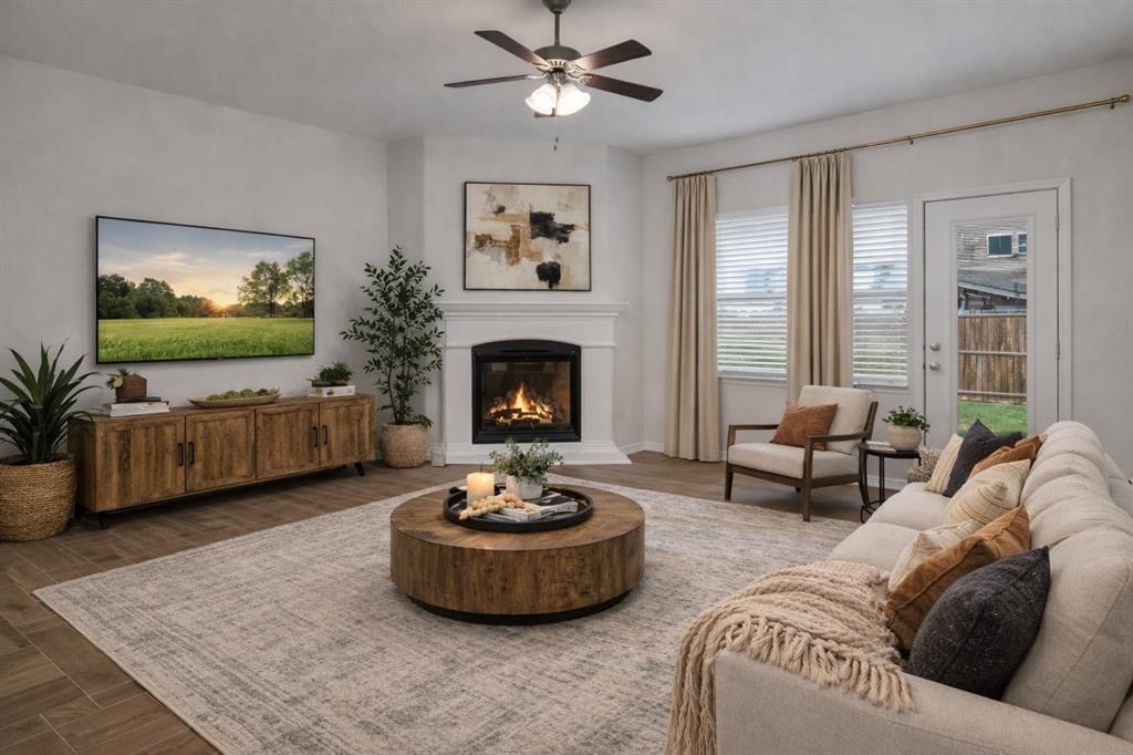 3106 Maverick Drive Forney, TX 75126 - Photo 5 of 32 a living room with furniture and a fireplace
