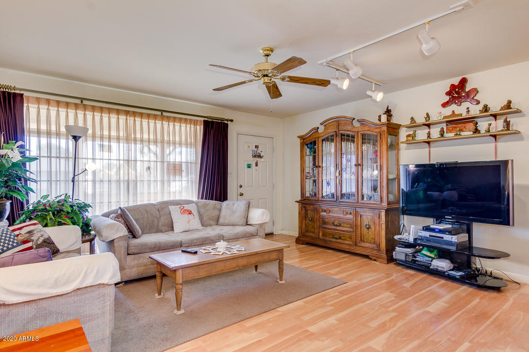 3320 West Ocotillo Road Phoenix, AZ 85017 - Photo 8 of 35 a living room with furniture and a flat screen tv