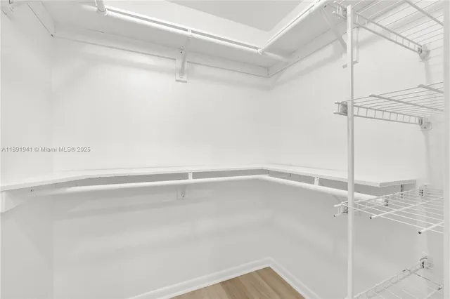 a view of a room with an empty walk in closet